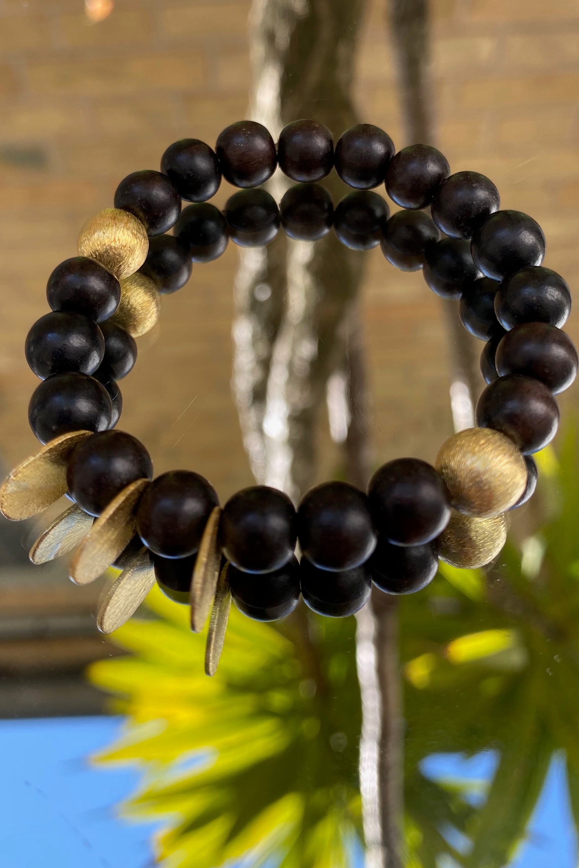 Precious bracelet in ebony and gold plated